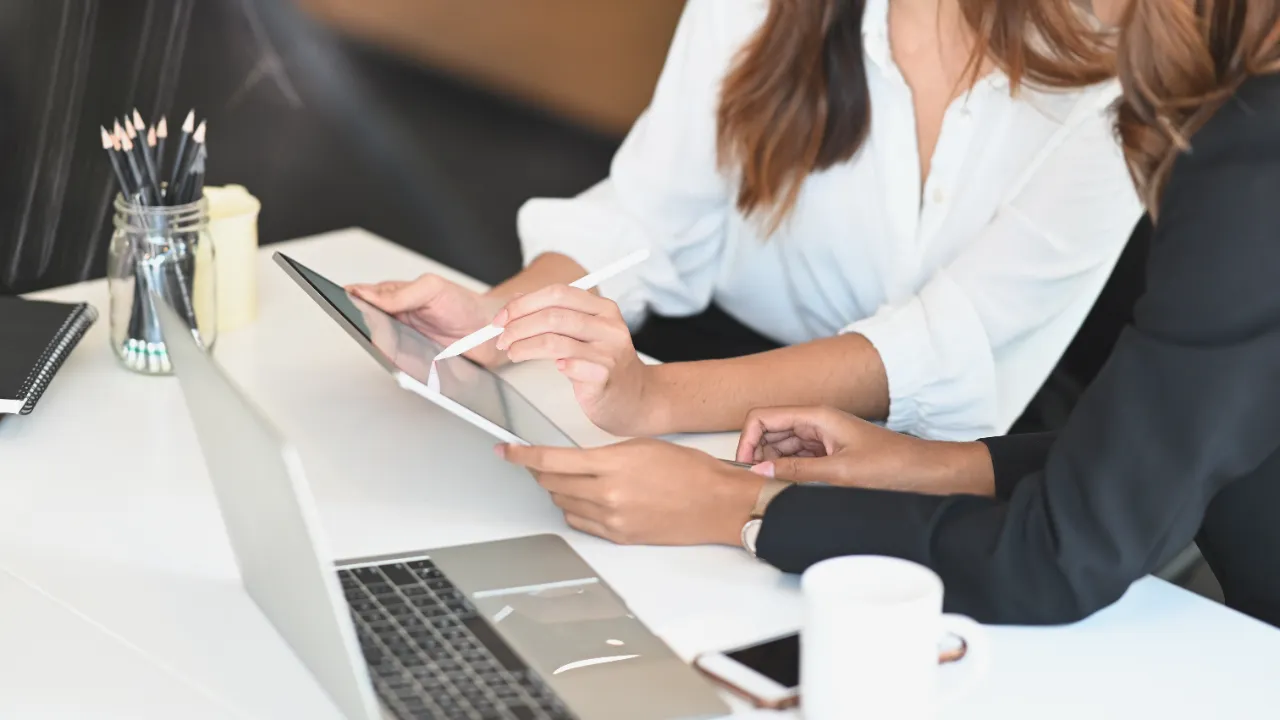 people looking at tablet